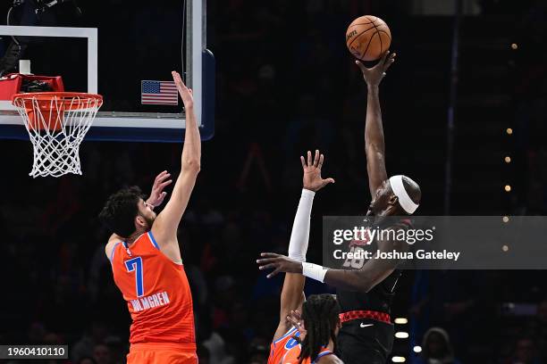 Duop Reath of the Portland Trail Blazers goes up for a shot over Chet Holmgren of the Oklahoma City Thunder during the first half at Paycom Center on...