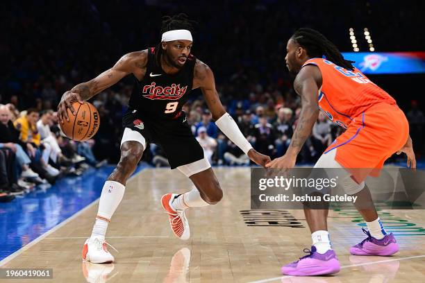 Jerami Grant of the Portland Trail Blazers looks to drive past Cason Wallace of the Oklahoma City Thunder during the second half at Paycom Center on...