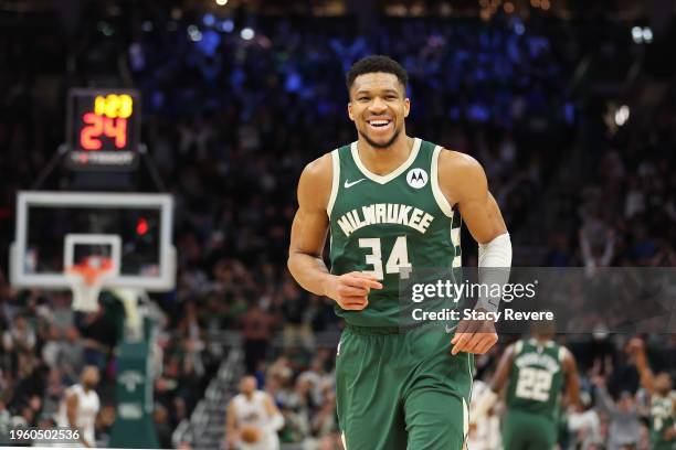 Giannis Antetokounmpo of the Milwaukee Bucks reacts to a three point shot during the second half of a game against the Cleveland Cavaliers at Fiserv...