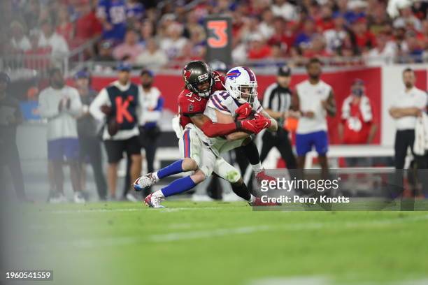 Cole Beasley of the Buffalo Bills is tackled by Ross Cockrell of the Tampa Bay Buccaneers during an NFL football game at Raymond James Stadium on...