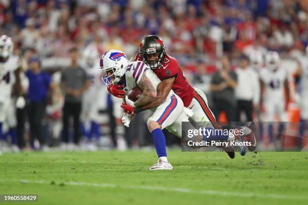 Cole Beasley of the Buffalo Bills is tackled by Ross Cockrell of the Tampa Bay Buccaneers during an NFL football game at Raymond James Stadium on...