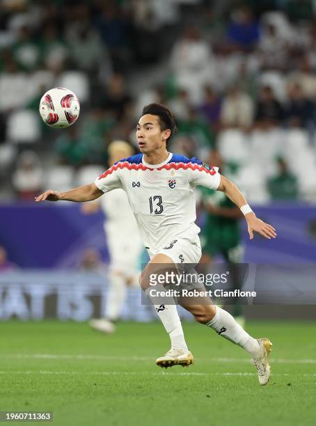 Jaroensak Wonggorn of Thailand controls the ball during the AFC Asian Cup Group F match between Saudi Arabia and Thailand at Education City Stadium...