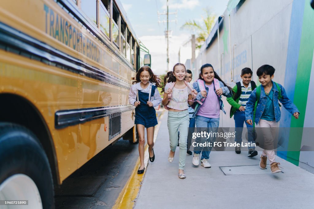 Child students running outside the school