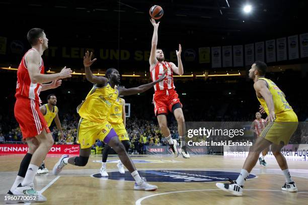 Rokas Giedraitis from Crvena Zvezda Meridianbet Belgrade in action followed by Khalifa Koumadje and Johannes Thiemann from Alba Berlin during the...