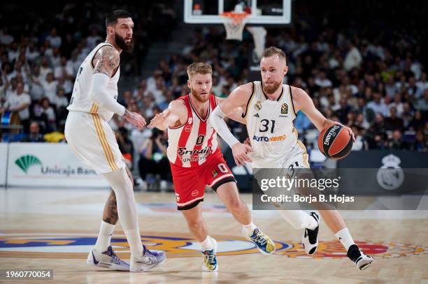 Dzanan Musa of Real Madrid and Thomas Walkup of Olympiacos Piraeus in action during the Turkish Airlines EuroLeague Regular Season Round 23 match...