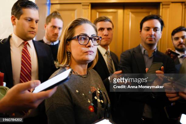 Sen Kyrsten Sinema speaks to reporters during a vote in the Senate Chambers of the U.S. Capitol Building on January 25, 2024 in Washington, DC....