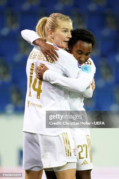 Ada Hegerberg of Olympique Lyonnais celebrates scoring her team's third goal with teammate Vicki Becho during the UEFA Women's Champions League group...