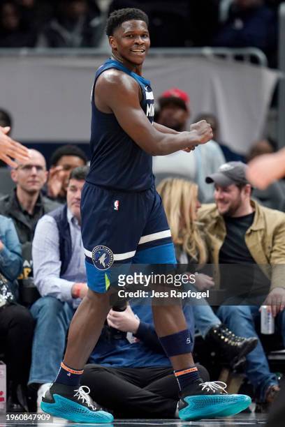 Anthony Edwards of the Minnesota Timberwolves reacts after scoring and drawing a foul against the Washington Wizards during the second half at...