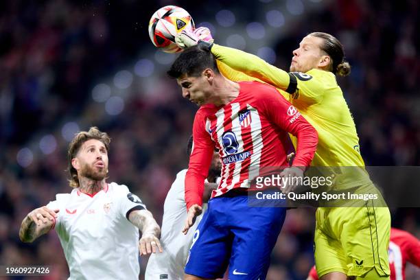 Alvaro Morata of Atletico de Madrid competes for the ball with Ørjan Nyland of Sevilla FC during the Copa del Rey Quarter Final match between...