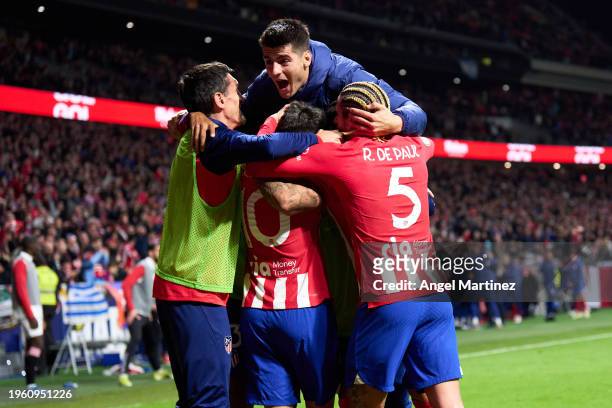 Memphis Depay of Atletico de Madrid celebrates with teammates after scoring the team's first goal during the Copa del Rey Quarter Final match between...