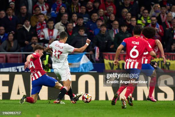 Pablo Barrios of Atletico de Madrid competes for the ball with Erik Lamela of Sevilla FC during the Copa del Rey Quarter Final match between Atletico...