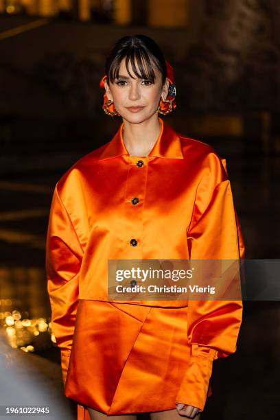 Actress Nina Dobrev is seen wearing orange jacket, skirt, bag outside Patou during the Haute Couture Spring/ Summer 2024 as part of Paris Fashion...
