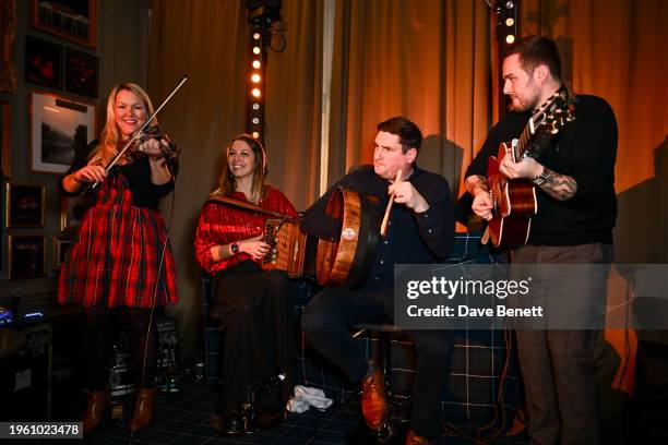 Ceilidh band performs at a special Burns Night celebration hosted by Christopher Kane at The London EDITION on January 25, 2024 in London, England.