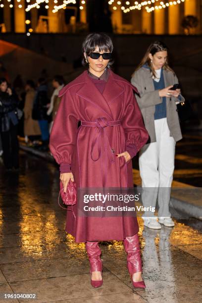 Kat Graham is seen wearing burgundy coat, bag, pants, heels outside Patou during the Haute Couture Spring/ Summer 2024 as part of Paris Fashion Week...