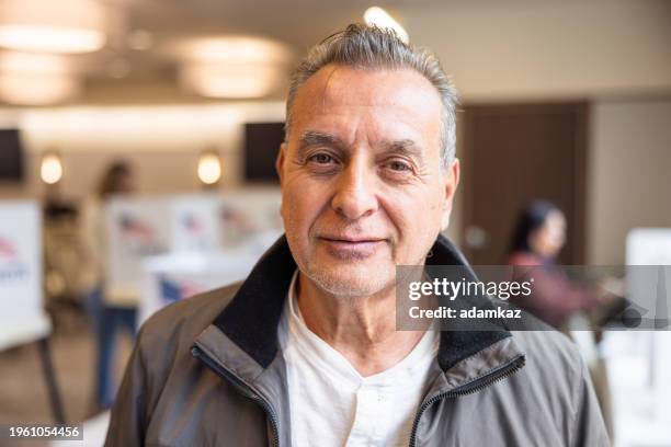 portrait of a senior man at election location - primary election stock pictures, royalty-free photos & images