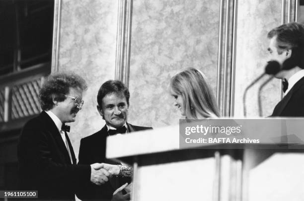 And RICK LLOYD winners of the 1987 ORIGINAL TELEVISION MUSIC Award for PORTERHOUSE BLUE presented by TWIGGY at the Awards Ceremony in 1988