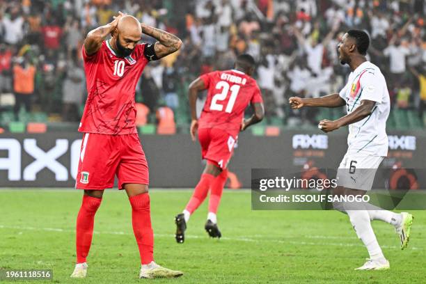 Equatorial Guinea's forward Emilio Nsue reacts to a missed penalty during the Africa Cup of Nations 2024 round of 16 football match between...