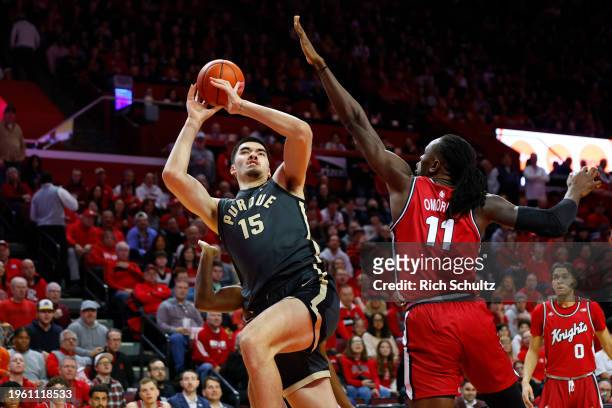 Zach Edey of the Purdue Boilermakers attempts a shot as Clifford Omoruyi of the Rutgers Scarlet Knights defends during the first half of a game at...