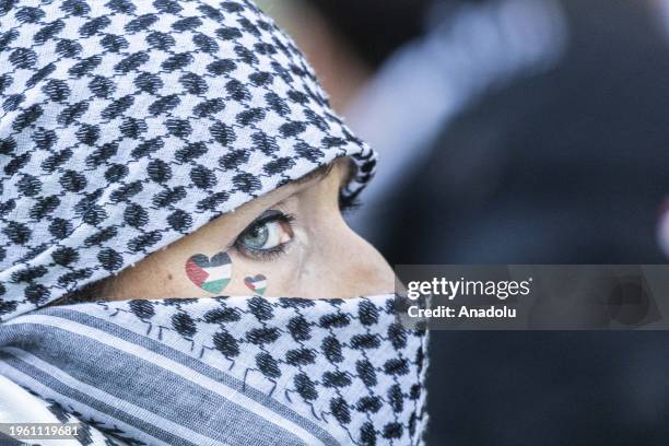 People gather as they hold banners and flags, to protest the Israeli attacks on Gaza and show solidarity with the Palestinians in Eindhoven,...