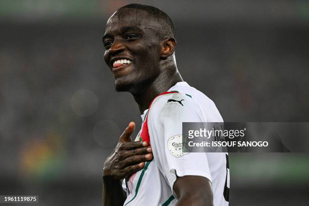 Guinea's defender Mouctar Diakhaby celebrates after the victory at the end of the Africa Cup of Nations 2024 round of 16 football match between...