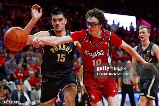 Gavin Griffiths of the Rutgers Scarlet Knights chases down a loose ball with Zach Edey of the Purdue Boilermakers during the second half of a game at...