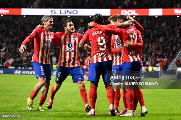 Atletico Madrid's Brazilian forward Samuel Lino celebrates scoring the opening goal, with teammates, during the Spanish league football match between...