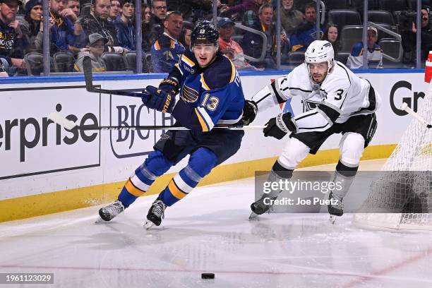 Matt Roy of the Los Angeles Kings and Alexey Toropchenko of the St. Louis Blues look for control of the puck on January 28, 2024 at the Enterprise...