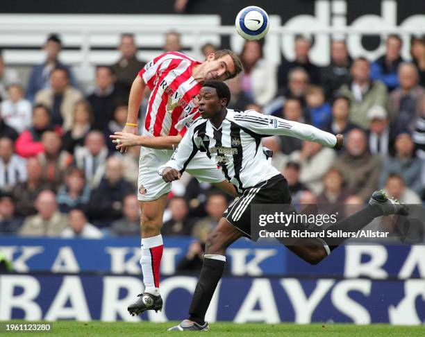 October 23: Shola Ameobi of Newcastle United and Alan Stubbs of Sunderland challenge during the Premier League match between Newcastle United and...