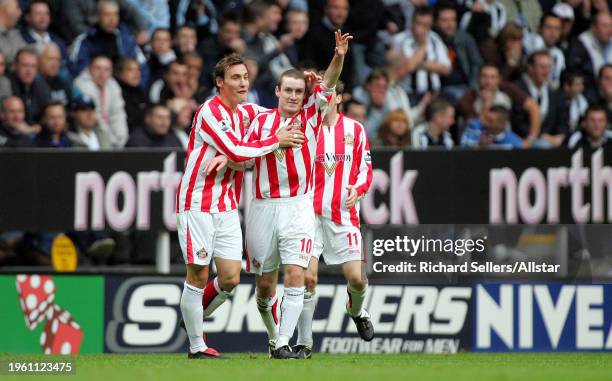 October 23: Stephen Elliott, Dean Whitehead and Andy Welsh of Sunderland celebrate during the Premier League match between Newcastle United and...