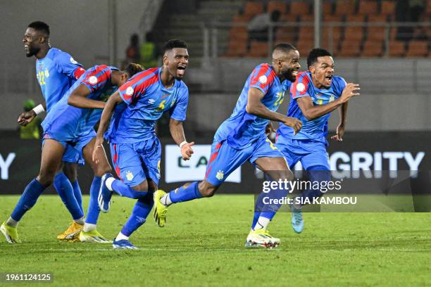 Congo's players celebrate after winning at the end of the Africa Cup of Nations 2024 round of 16 football match between Egypt and DR Congo at the...