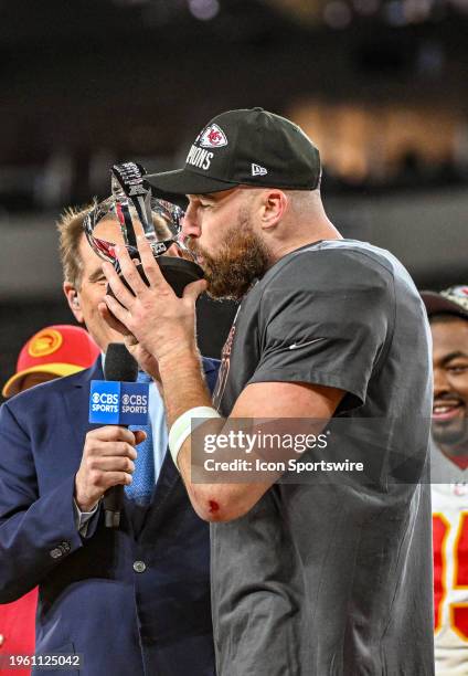 Kansas City Chiefs tight end Travis Kelce celebrates the win by kissing the Lamar Hunt trophy following the Kansas City Chiefs game versus the...