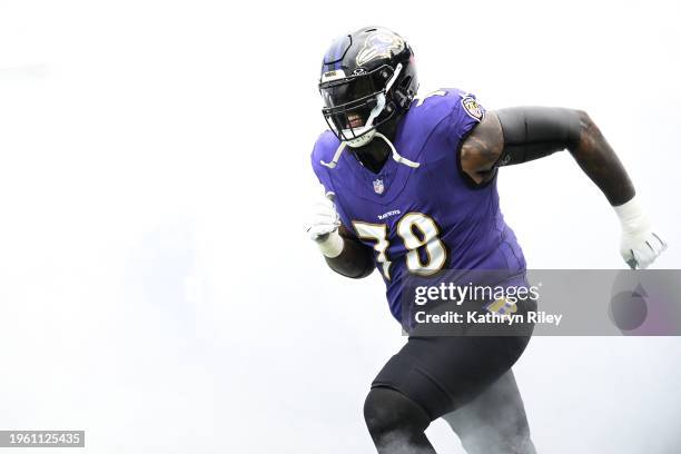 Morgan Moses of the Baltimore Ravens runs onto the field prior to the start of the AFC Championship game against the Kansas City Chiefs at M&T Bank...