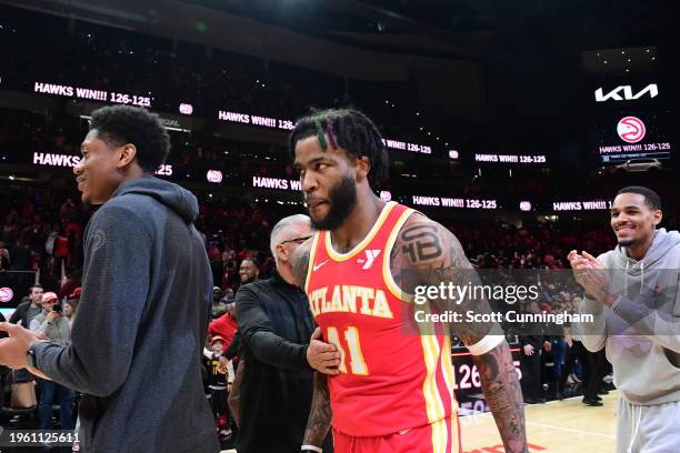 The Atlanta Hawks celebrate the game winning dunk by Saddiq Bey during the game against the Toronto Raptors on January 28, 2024 at State Farm Arena...