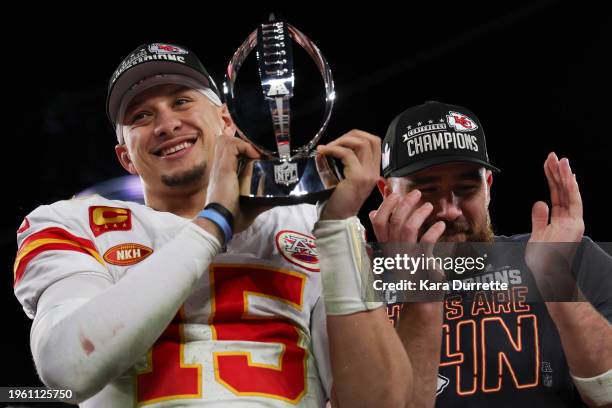 Patrick Mahomes of the Kansas City Chiefs holds the Lamar Hunt Trophy with Travis Kelce after the AFC championship game against the Baltimore Ravens...