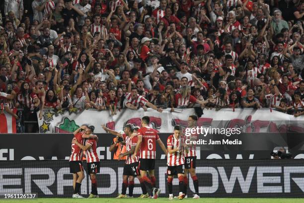 Eros Mancuso of Estudiantes celebrates with teammates after scoring his team's first goal during a match between Estudiantes and Belgrano as part of...