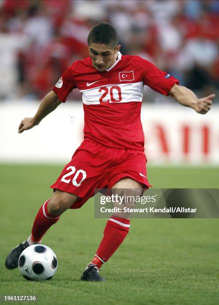 June 25: Sabri Sarioglu of Turkey kicking during the UEFA Euro 2008 Semi Final match between Germany and Turkey at St Jakob-park on June 25, 2008 in...
