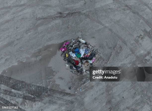 An aerial view of the belongings of the migrants as Texas National Guard soldiers continue to take security measures at Eagle Pass, Texas at...