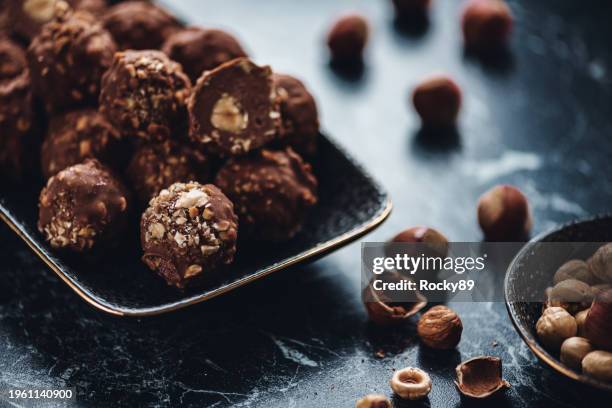 hazelnut chocolate truffles - chocolate pieces stock-fotos und bilder