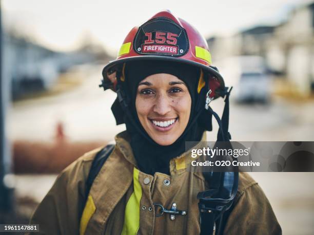 female firefighter - firefighter stock pictures, royalty-free photos & images