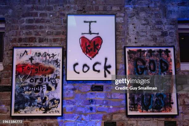 Individual pieces based on scrawled graffiti are displayed on January 25, 2024 in London, England. The show features installations and graphics...