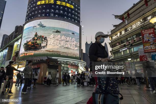 Pedestrians at the Dongmen Old Street shopping area in Shenzhen, China, on Thursday, Jan. 18, 2024. China's deflation pressures are likely to...