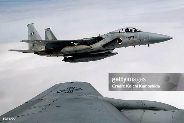 Japanese F-15 aircraft alongside a U.S. Pacific Air Forces KC-135 in the first Joint Japan and U.S. Air re-fuelling training April 30, 2003 over the...