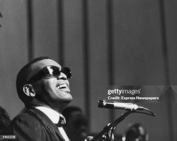 American soul singer and pianist Ray Charles sings on stage during his first British concert appearance at Finsbury Park, London, England, May 13,...