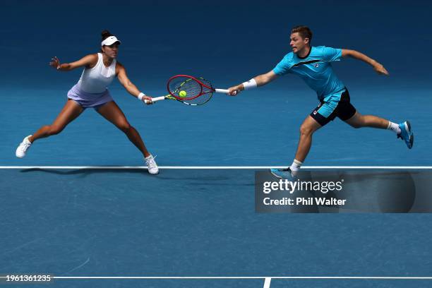 Neal Skupski of Great Britain and Desirae Krawczyk of the United States play a shot in their Mixed Doubles Final match against Hsieh Su-wei of...