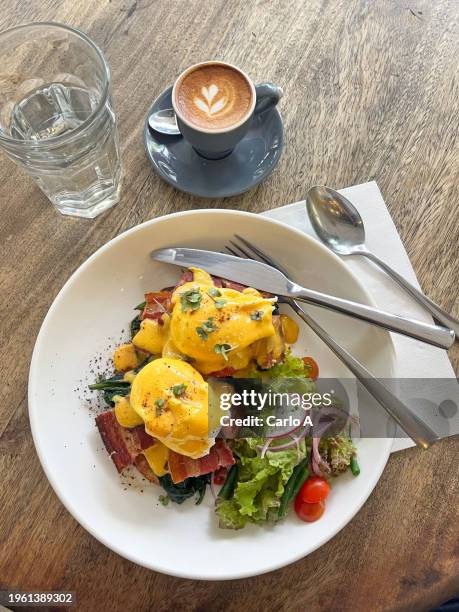 egg benedicts and bacon on toasted bread - butter coffee stock pictures, royalty-free photos & images