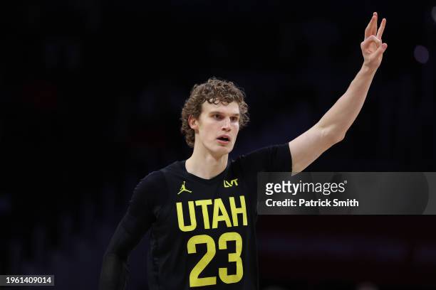 Lauri Markkanen of the Utah Jazz celebrates after scoring a basket against the Washington Wizards during the second half at Capital One Arena on...