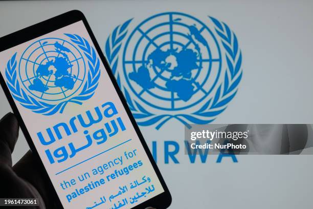 The UNRWA logo is being displayed on a smartphone with UNRWA visible in the background in this photo illustration, in Brussels, Belgium, on January...