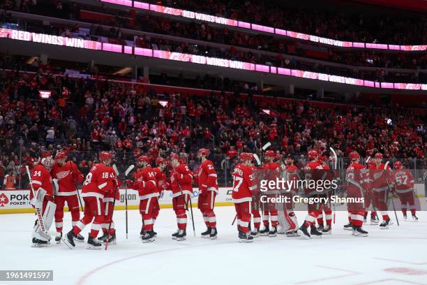 The Detroit Red Wings celebrate a 3-0 win over the Philadelphia Flyers at Little Caesars Arena on January 25, 2024 in Detroit, Michigan.