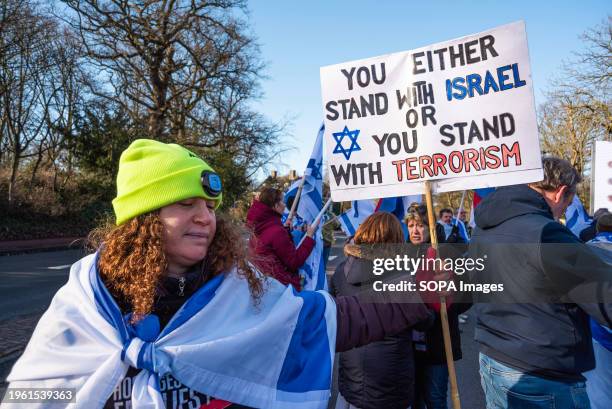 Israeli woman supporter with banner expressing her opinion, during today's International Court of Justice First ruling on Israelís Gaza war. The ICJ...