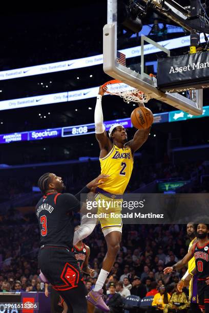 Jarred Vanderbilt of the Los Angeles Lakers makes a slam dunk against Andre Drummond of the Chicago Bulls in the first half at Crypto.com Arena on...